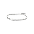 Silver cuff bracelet with an organic shape and lightly textured surface on a white background.