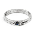 Handcrafted sterling silver ring with a blue gemstone from a Berlin based jewelry studio on a white background