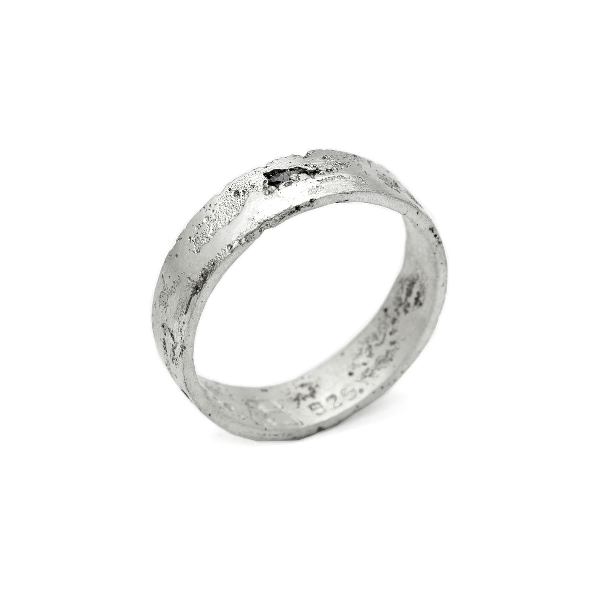 Kaewkosin ring in sterling silver with a black moissanite, artisan handcrafted jewelry featuring an organic textured surface and polshid interior