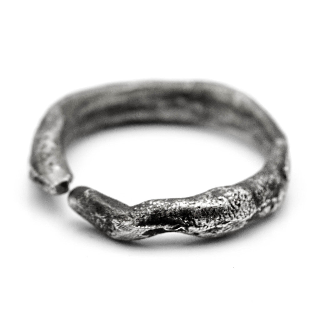 Oxidised silver ring with a treebark texture, handmade by Berlin jewelry studio.