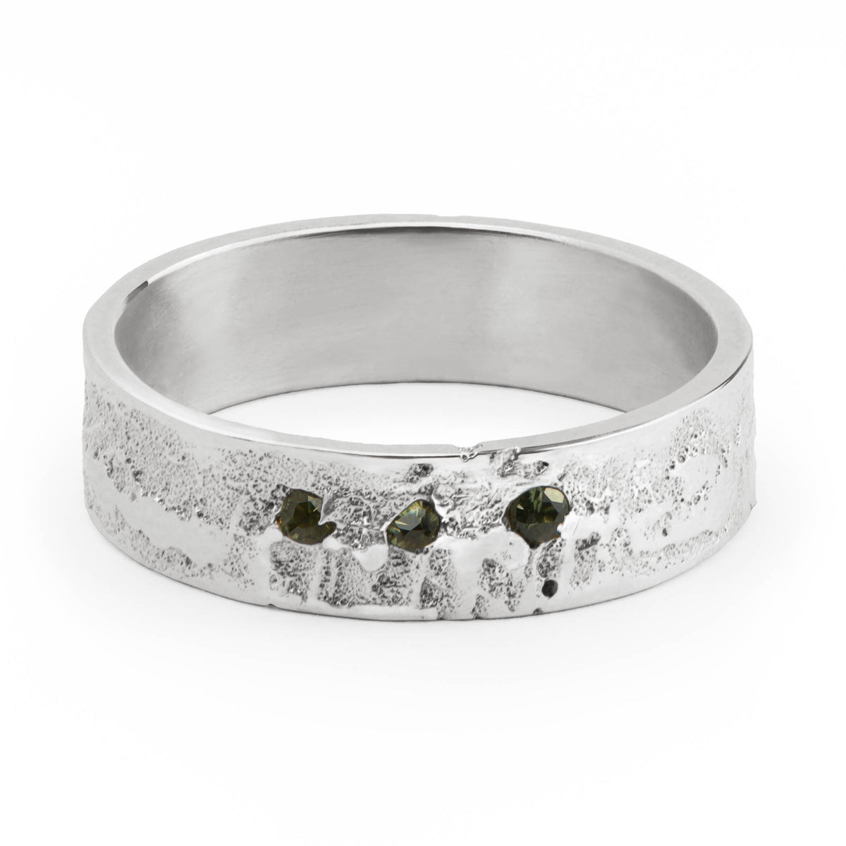 Silver ring with 3 embedded stones on a white background