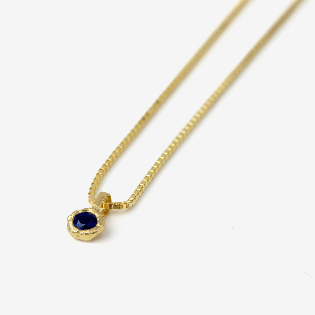 Gold Charm Necklace With Blue Sapphire
