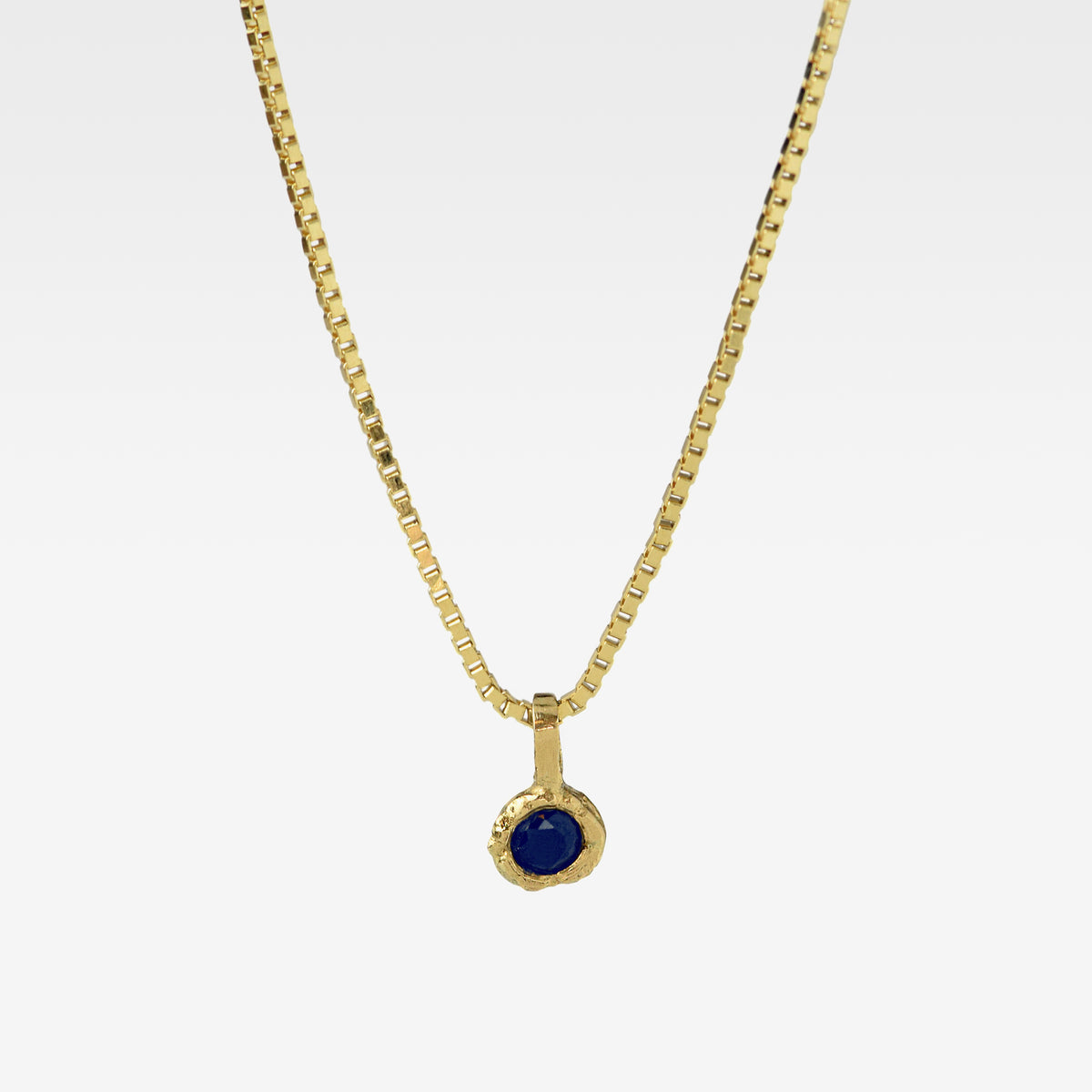 Gold Charm Necklace With Blue Sapphire
