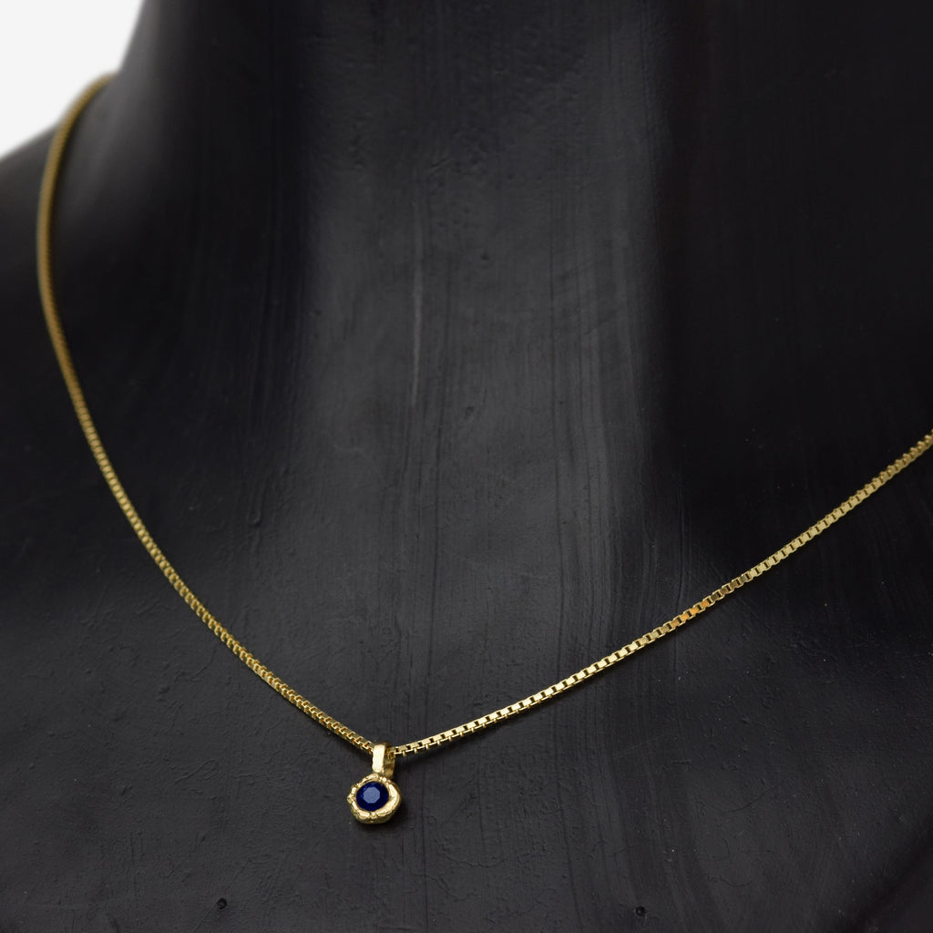 Gold Charm Necklace With Blue Sapphire