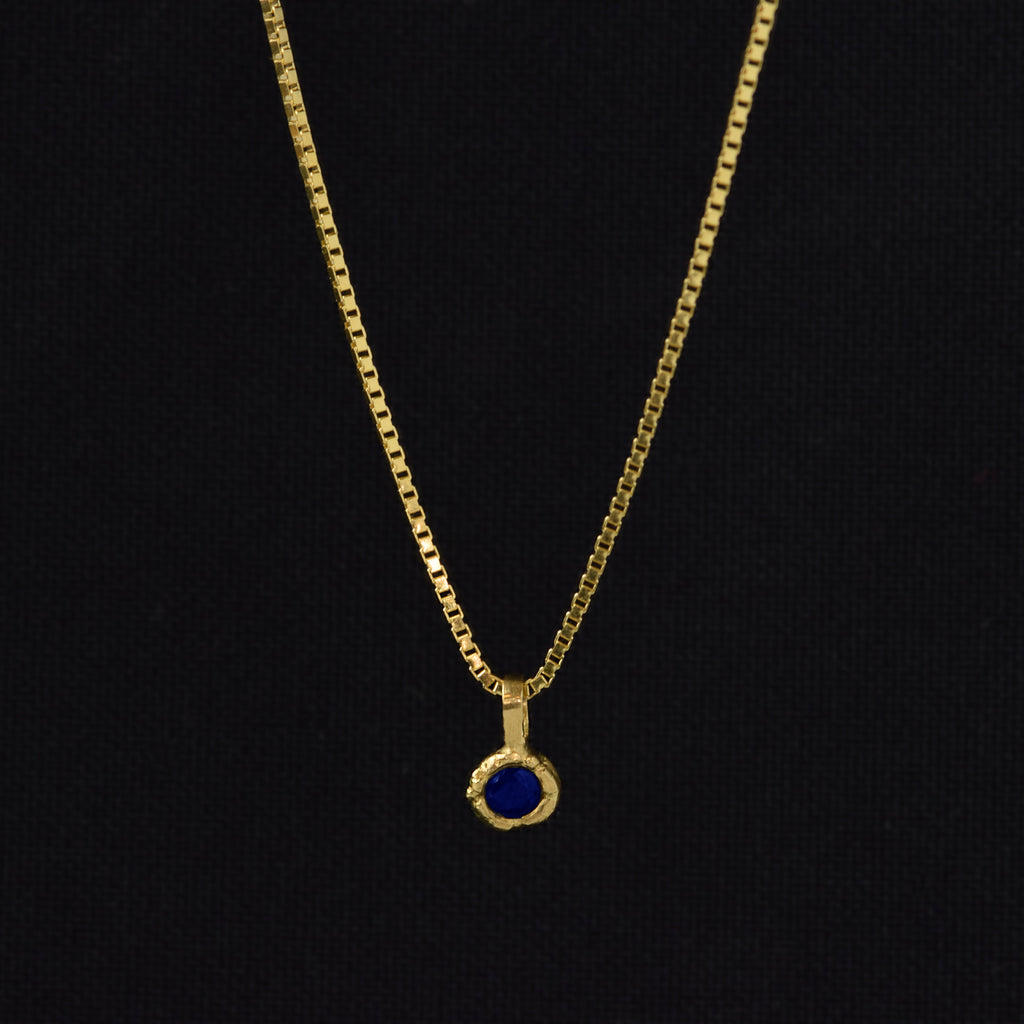 Gold Charm Necklace With Blue Sapphire