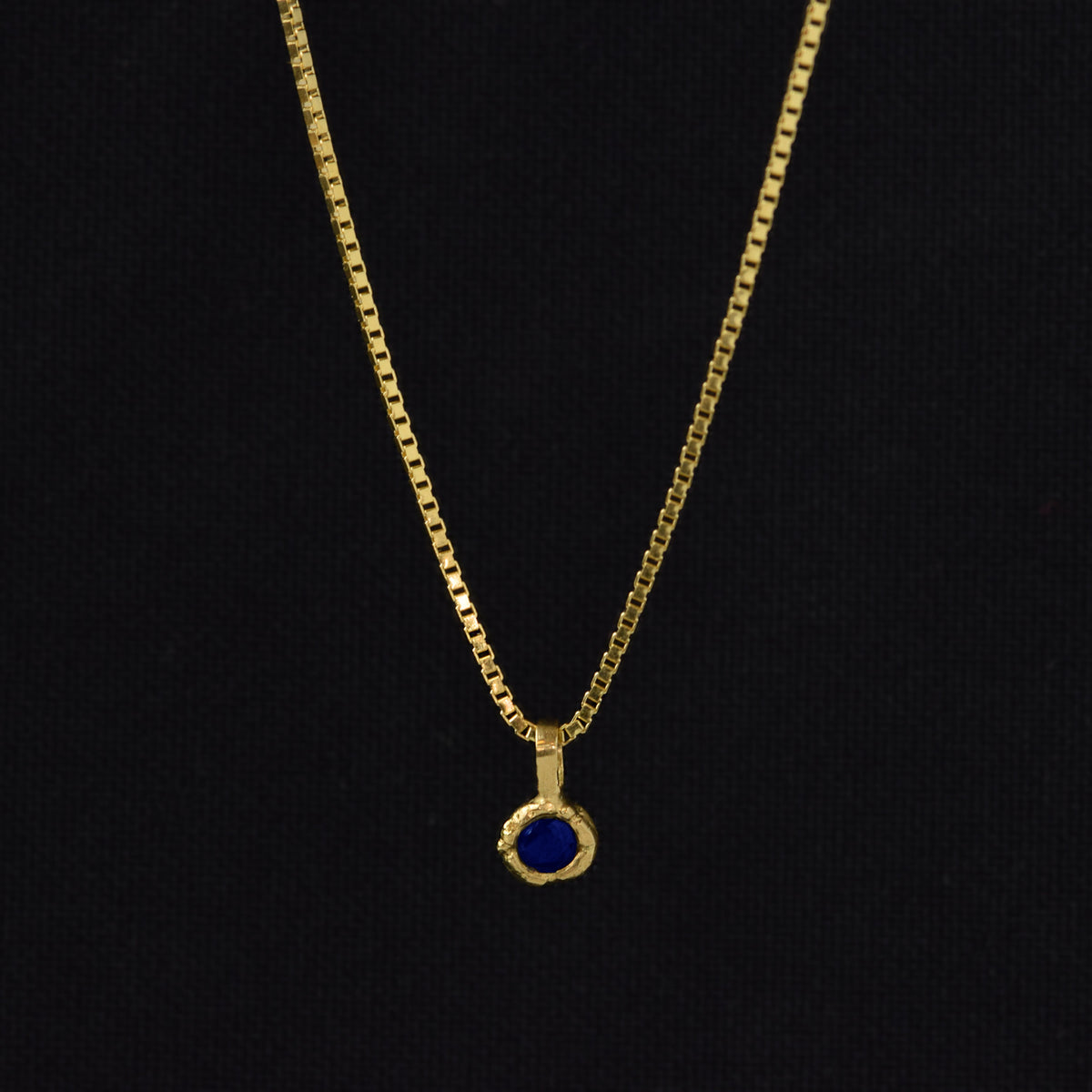 Gold Charm Necklace With Blue Sapphire